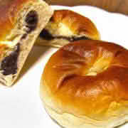 A plate of two Anpan, a traditional Japanese sweet bread filled with red bean paste
